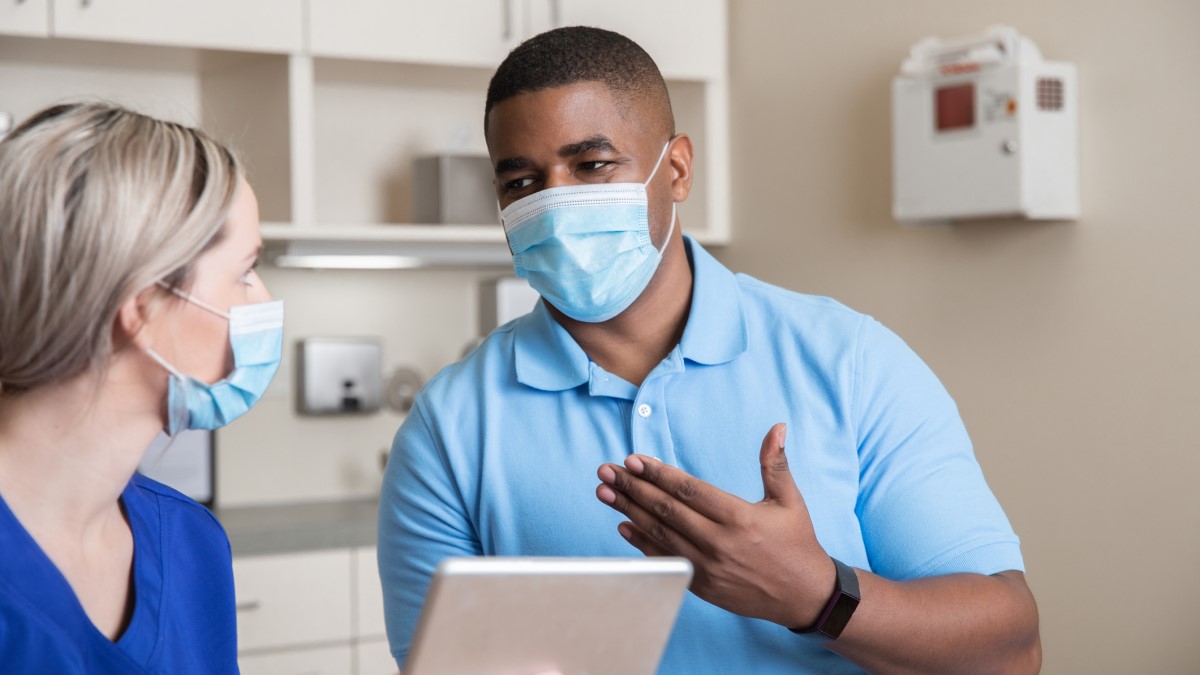 ask doctor Photo of a man asking his doctor a question